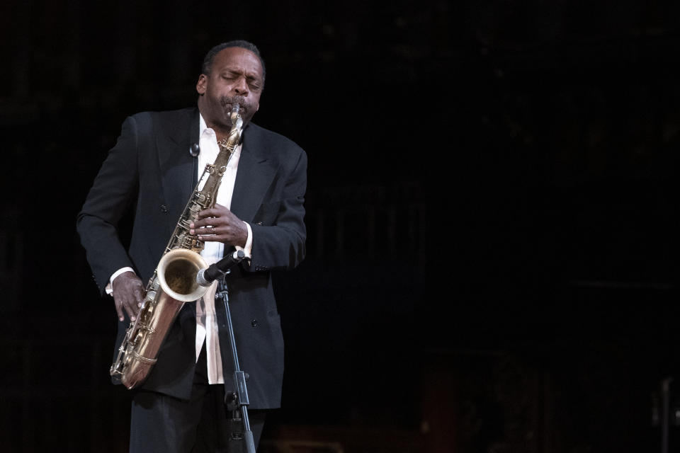 Musician David Murray plays during the Celebration of the Life of Toni Morrison, Thursday, Nov. 21, 2019, at the Cathedral of St. John the Divine in New York. (AP Photo/Mary Altaffer)