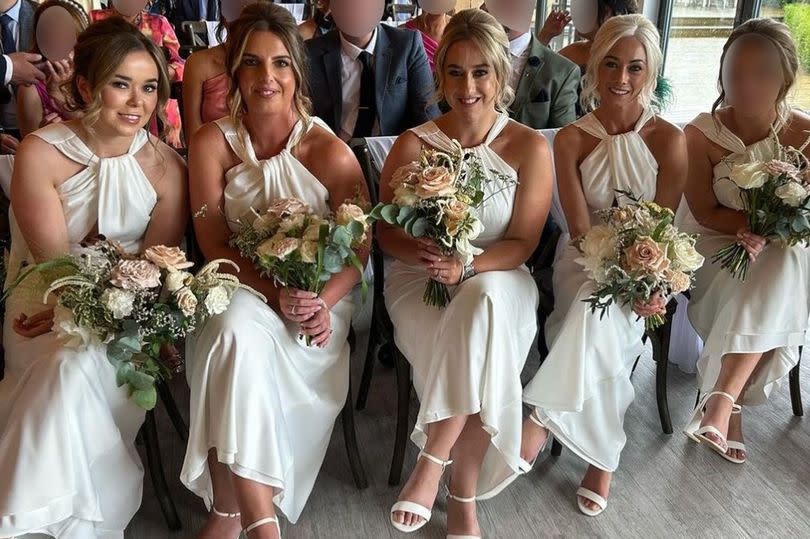 Five bridesmaids all wearing white