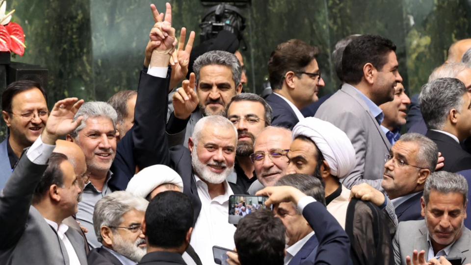 Ismail Haniyeh was surrounded by Iranian lawmakers at the Iranian parliament in Tehran on 30 July