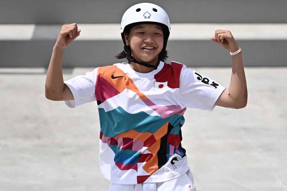 <p>Japan's Momiji Nishiya celebrates after performing a trick during the skateboarding women's street final of the Tokyo 2020 Olympic Games at Ariake Sports Park in Tokyo on July 26, 2021. (Photo by Lionel BONAVENTURE / AFP) (Photo by LIONEL BONAVENTURE/AFP via Getty Images)</p> 