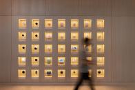 <p>Google Store Chelsea. Nest Wall -- a wall featuring five rows of seven columns of boxes each holding a Nest product.</p> 