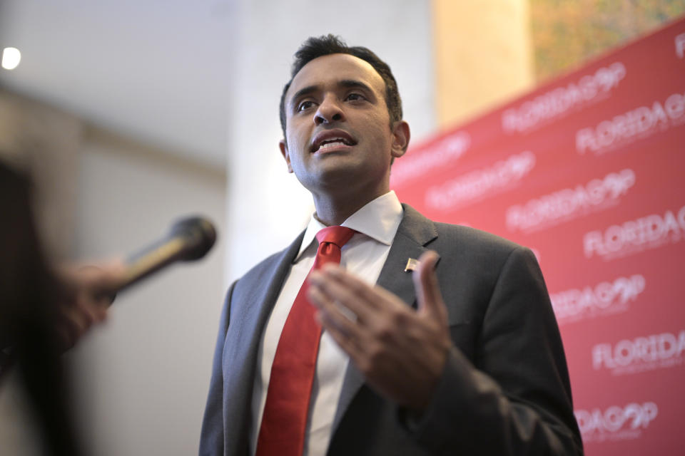 Republican presidential candidate Vivek Ramaswamy answers questions from reporters after speaking at the Republican Party of Florida Freedom Summit, Saturday, Nov. 4, 2023, in Kissimmee, Fla. (AP Photo/Phelan M. Ebenhack)