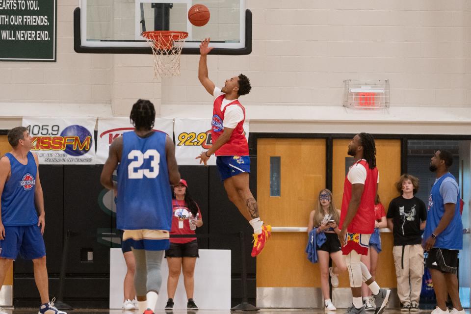 Devon Dotson jumps up to lay one in during Thursday's Rock Chalk Roundball Classic charity exhibition.