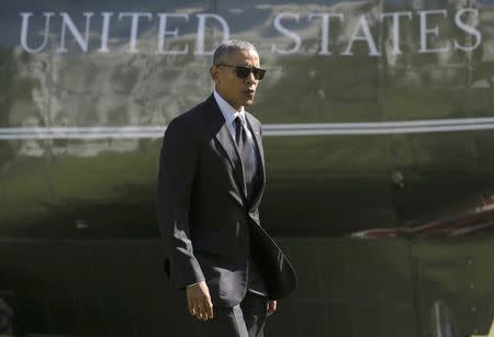 U.S. President Barack Obama walks from Marine One as he returns to the White House in Washington, U.S., October 14, 2016. REUTERS/Joshua Roberts