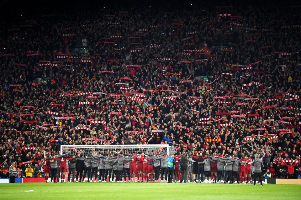 Liverpool players celebrate with fans after the UEFA Champions League Semi Final second leg match between Liverpool and Barcelona at Anfield: Shaun Botterill/Getty Images