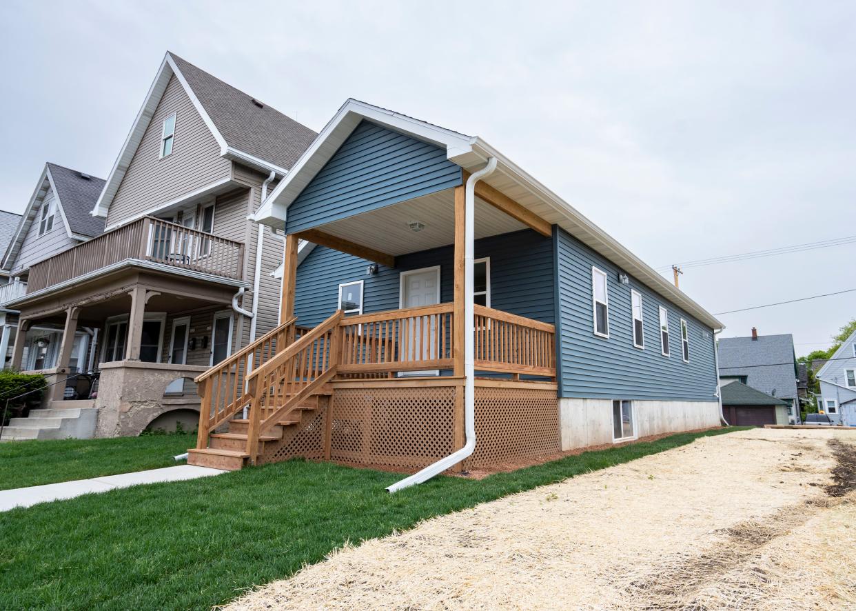 The first completed home at 1217 S. 35th St. becomes part of the nearly 50 affordable houses for Milwaukee child care workers in Milwaukee, Wis.