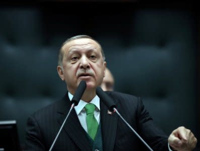 FILE PHOTO: Turkey's President Tayyip Erdogan addresses members of parliament from his ruling AK Party during a meeting at the Turkish parliament in Ankara, Turkey, January 16, 2018. Yasin Bulbul/Presidential Palace/Handout via REUTERS