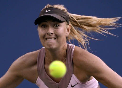 Russia's Maria Sharapova plays a return to Melinda Czink of Hungary during their US Open women's first round match in New York on Monday. Sharapova dispatched Czink 6-2, 6-2