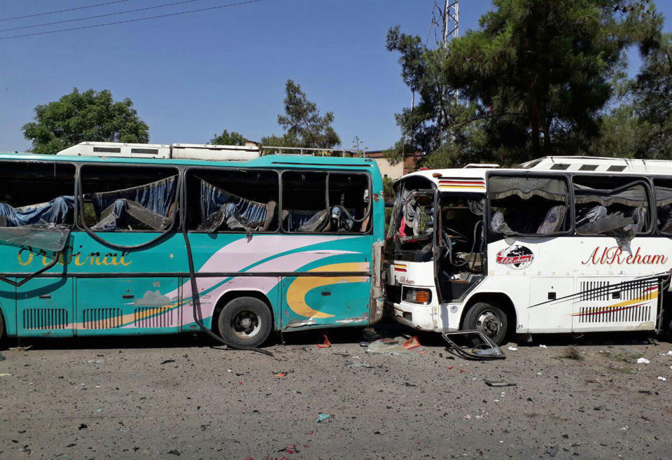 <p>This photo released by the Syrian official news agency SANA, shows several damaged buses along the road to the airport in southeast Damascus, Syria, Sunday, July 2, 2017. Syrian state TV said Sunday that a series of car bomb explosions have rocked the capital, resulting in multiple casualties. (SANA via AP) </p>