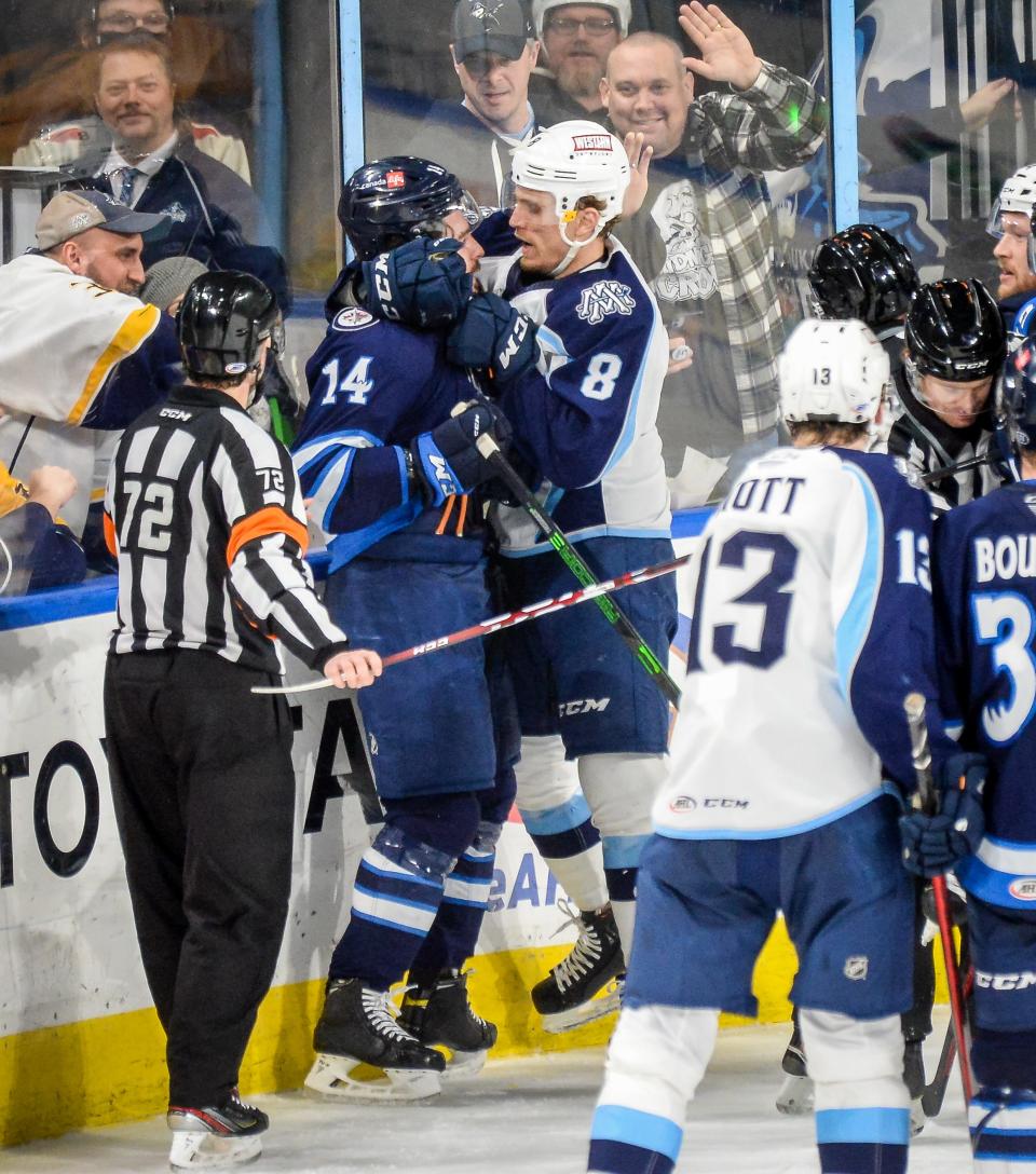 Milwaukee Admirals defenseman Matt Tennyson and Manitoba Moose defenseman Jimmy Oligny exchage shoves in a game Jan. 12 at the UW-Milwaukee Panther Arena.