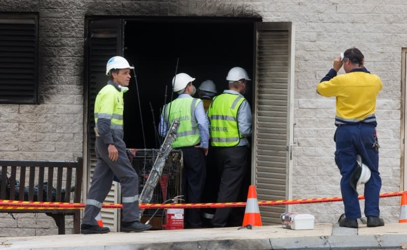 Investigators examine the inside of the building. Picture Mogens Johansen/The West Australian