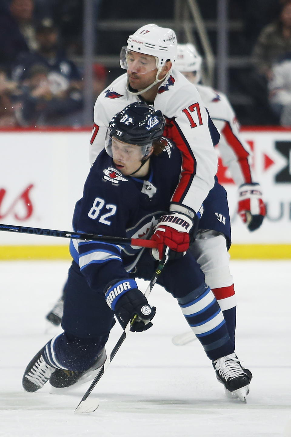 Winnipeg Jets' Mason Appleton (82) and Washington Capitals' Ilya Kovalchuk (17) collide during the second period of an NHL hockey game Thursday, Feb. 27. 2020, in Winnipeg, Manitoba. (John Woods/The Canadian Press via AP)