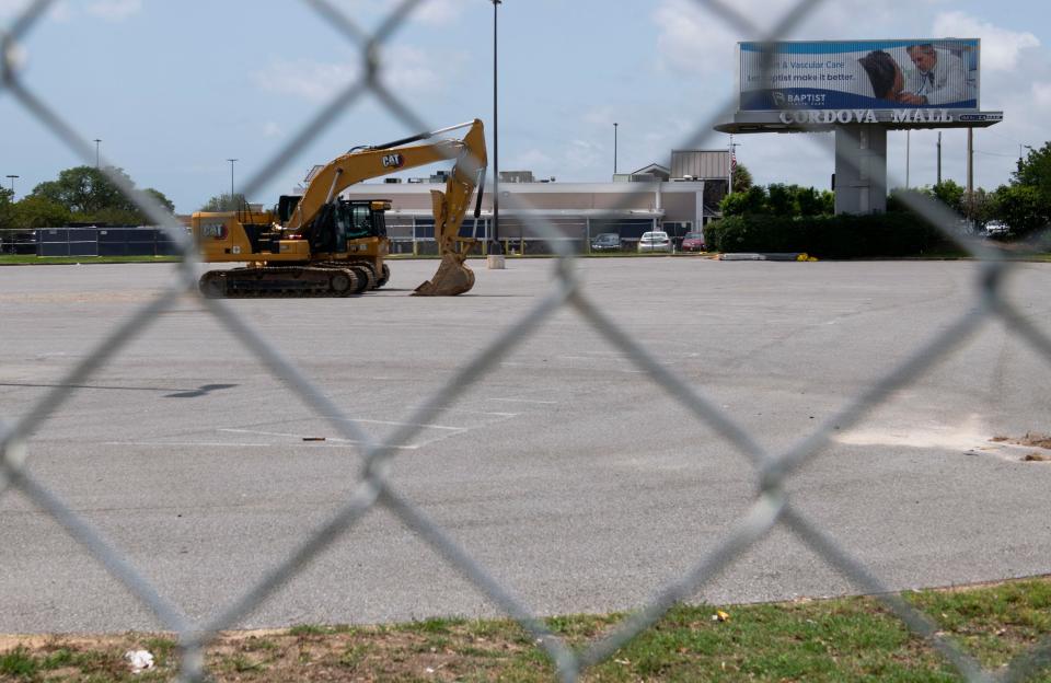 A portion of the Cordova Mall property on Ninth Avenue across from Ascension Sacred Heart is fenced off, and heavy construction equipment is ready to break ground on future development.