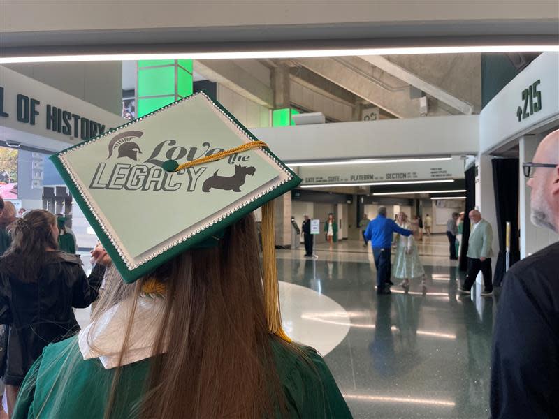 Erin Sawyer shows off her graduation cap on May 5, 2023, at the Breslin Center just before the university's spring commencement