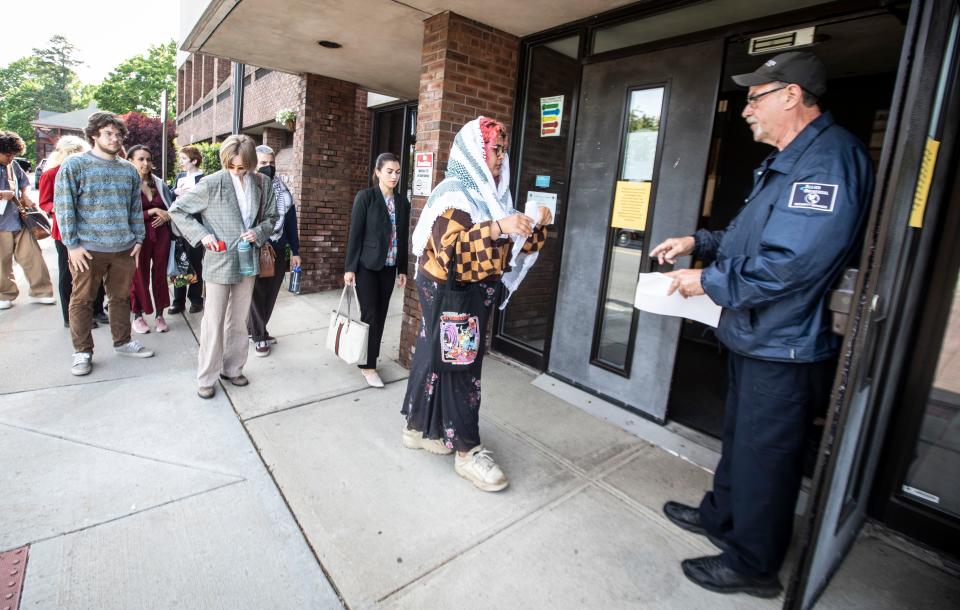 Purchase College student Sabrina Thompson and other students enter the Town of Harrison Municipal Building May 14, 2024 where they were scheduled to appear in court after being arrested during demonstrations at a pro-Palestinian encampment on campus May 2nd.