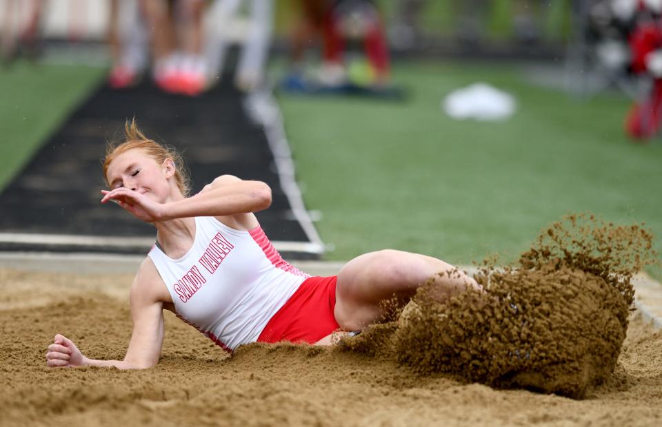 Sandy Valley's Lexi Tucci lands a school-record 18 feet, 1 inch long jump during Tuesday's quad meet against Indian Valley, Malvern and Tusky Valley,