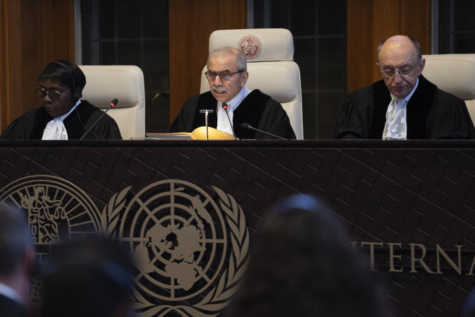 Presiding judge Nawaf Salam, center, opens the court session of the International Court of Justice in The Hague, Netherlands, Tuesday, April 30, 2024, where the United Nations' top court is ruling on a request by Nicaragua for judges to order Germany to halt military aid to Israel, arguing that Berlin's support enables acts of genocide and breaches of international humanitarian law in Gaza. (AP Photo/Peter Dejong)