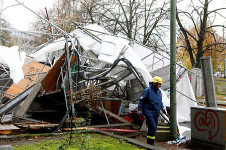 Federal Agency for Technical Relief (THW) workers dismantle scaffolding overturned by storm called "Herwart," in Berlin, Germany October 29, 2017. REUTERS/Axel Schmidt