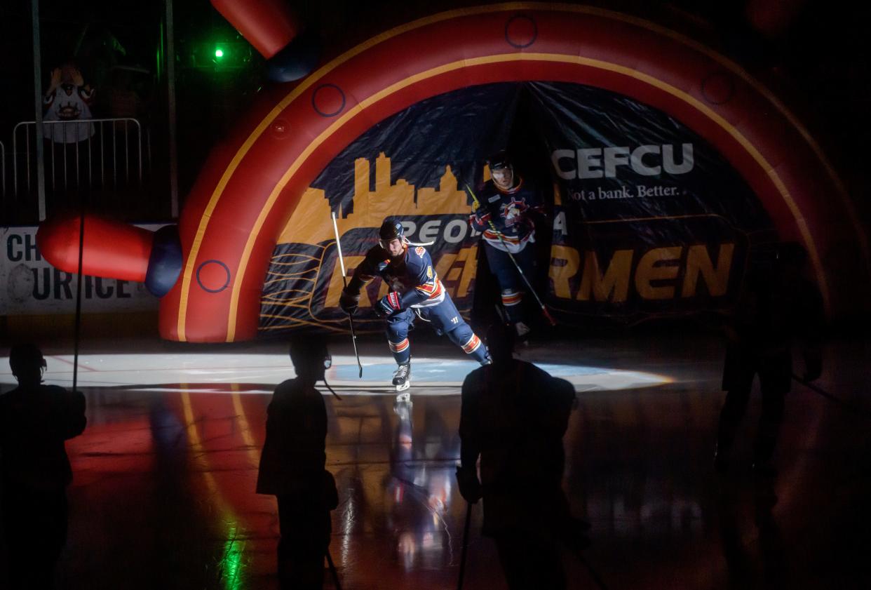 Dale Deon (4) and the rest of the Peoria Rivermen take the ice during player introductions before the start of their SPHL playoff game Saturday, April 16, 2022 at Carver Arena. The Rivermen advanced to the second round with a 4-2 win over the Pensacola Ice Flyers.