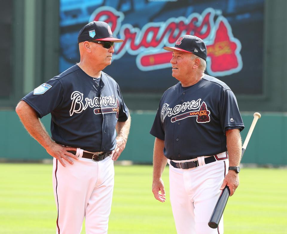 Dave Trembley's baseball career included a stint as director of player development for the Atlanta Braves. He's shown here (right) in 2018 with Braves manager Brian Snitker.