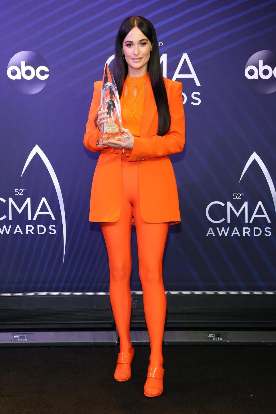 Kacey Musgraves poses with an award at the 52nd annual CMA Awards