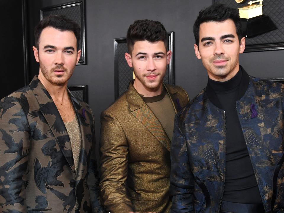 The Jonas Brothers pose on the red carpet of the 2020 Grammys.