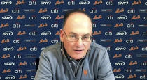 This still image from video shows New York Mets owner, Chairman & CEO Steve Cohen during a news conference, Wednesday, Dec. 1, 2021. The Mets and three-time Cy Young Award winner Max Scherzer finalized a $130 million, three-year deal Wednesday, a contract that shattered baseball's record for highest average salary and forms a historically impressive 1-2 atop New York's rotation with Jacob deGrom. (New York Mets via AP)