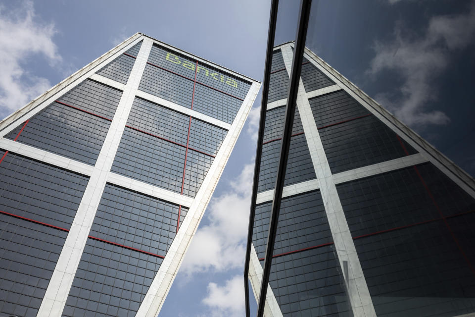 View of the Bankia tower in Madrid, Spain, Thursday, Sept. 17, 2020. Two of Spain's biggest banks are poised to merge and create the country's largest bank in terms of domestic operations, with assets of more than 600 billion euros ($708 billion). A tie-up between CaixaBank, the largest bank in the domestic market, and Bankia, Spain's biggest mortgage lender, could herald other moves toward consolidation in the financial sector. (AP Photo/Bernat Armangue)