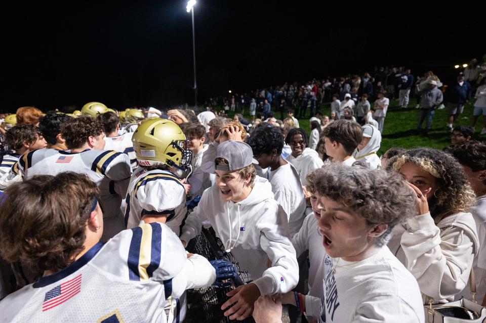 Shrewsbury High players and fans celebrate after defeating St. John's 13-10 Friday September 22, 2023 in Shrewsbury.