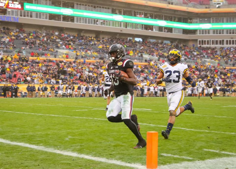 From January 01, 2018: South Carolina wide receiver Shi Smith (13) scores a touchdown during the second half of the Outback Bowl game against Michigan at Raymond James Stadium in Tampa.