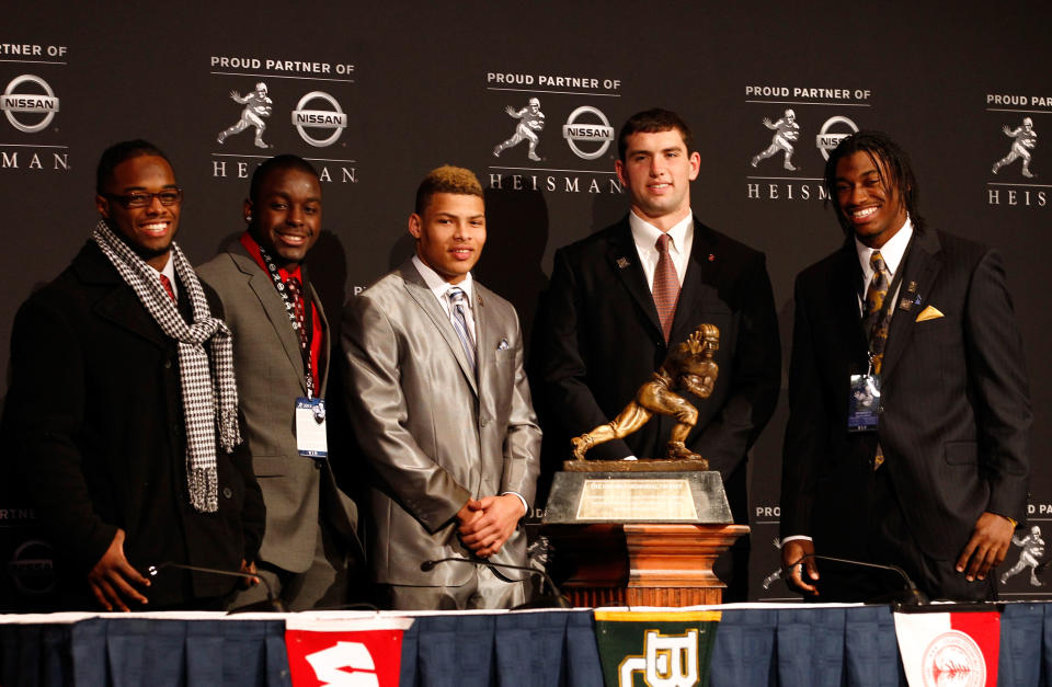 NEW YORK, NY - DECEMBER 10: (L-R) Heisman Trophy finalists running back Trent Richardson of the Alabama Crimson Tide, running back Montee Ball of the Wisconsin Badgers, cornerback Tyrann Mathieu of the LSU Tigers, Andrew Luck of the Stanford University Cardinal and quarterback Robert Griffin III of the Baylor Bears pose with the Heisman Trophy after a press conference at The New York Marriott Marquis on December 10, 2011 in New York City. (Photo by Jeff Zelevansky/Getty Images)