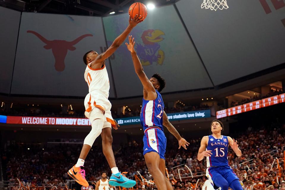 Texas guard Jabari Rice drives to the basket against Kansas' KJ Adams Jr. during UT's March 4 win at Moody Center. The Longhorns went 17-1 at home in their first season in the new facility.