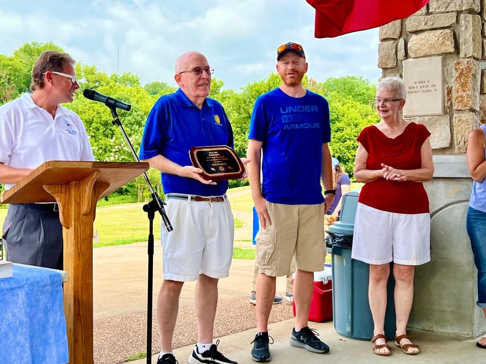 Steve Konz, second from left, is honored for his service as a U.S. veteran during Columbia's annual 4th of July celebration at Riverwalk Park.