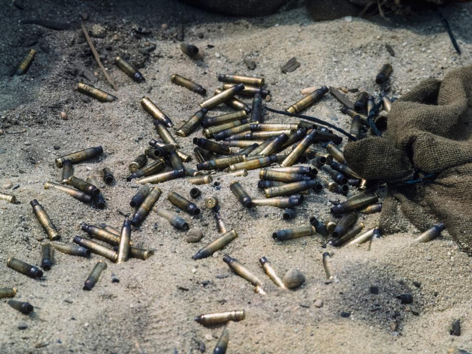 A pile of empty brass casings from M16 rifles on the group at the Fort Dix firing range, New Jersey, in 1967.