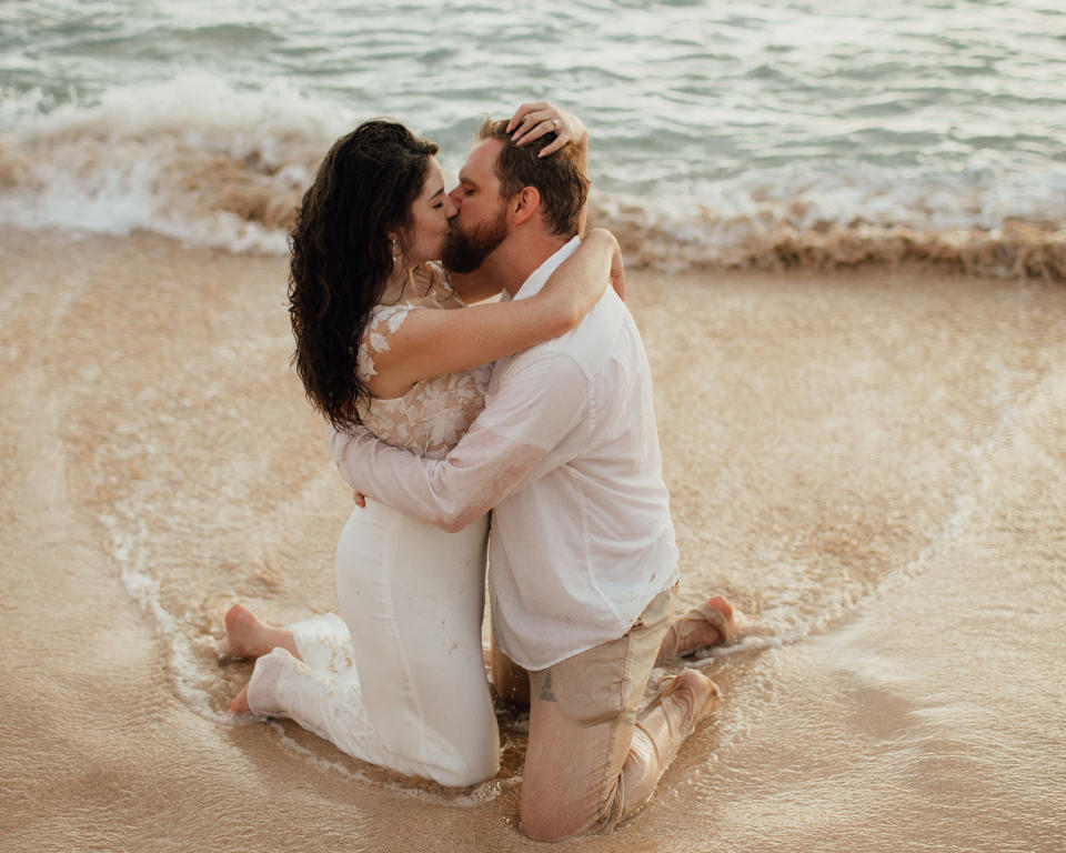 couple kissing beach photo