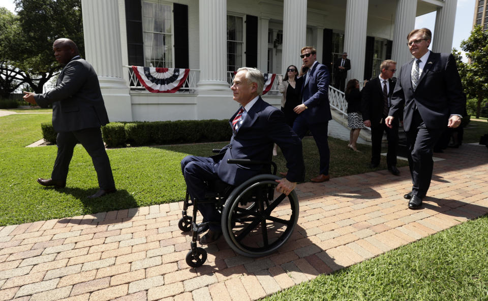 Governor Greg Abbott is followed by Lt. Governor Dan Patrick after a joint press conference to announce changes to teacher pay and school finance at the Texas Governor's Mansion in Austin, Texas, Thursday, May 23, 2019, in Austin. (AP Photo/Eric Gay)