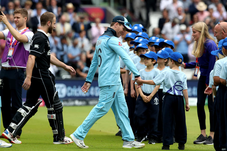 England's Eoin Morgan (centre) walks out ahead of the during the ICC World Cup Final at Lord's, London.