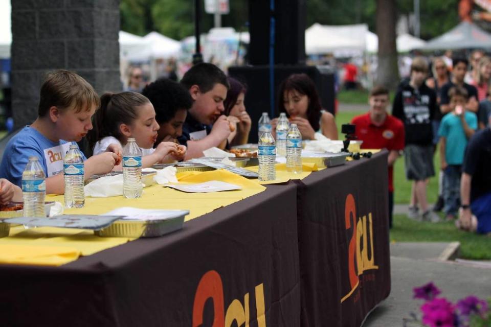 The South Sound BBQ Festival’s chicken-wing eating contest requires strategy as well as speed.