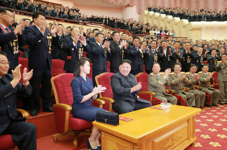 North Korean leader Kim Jong Un claps during a celebration for nuclear scientists and engineers who contributed to a hydrogen bomb test, September 2017. KCNA via REUTERS