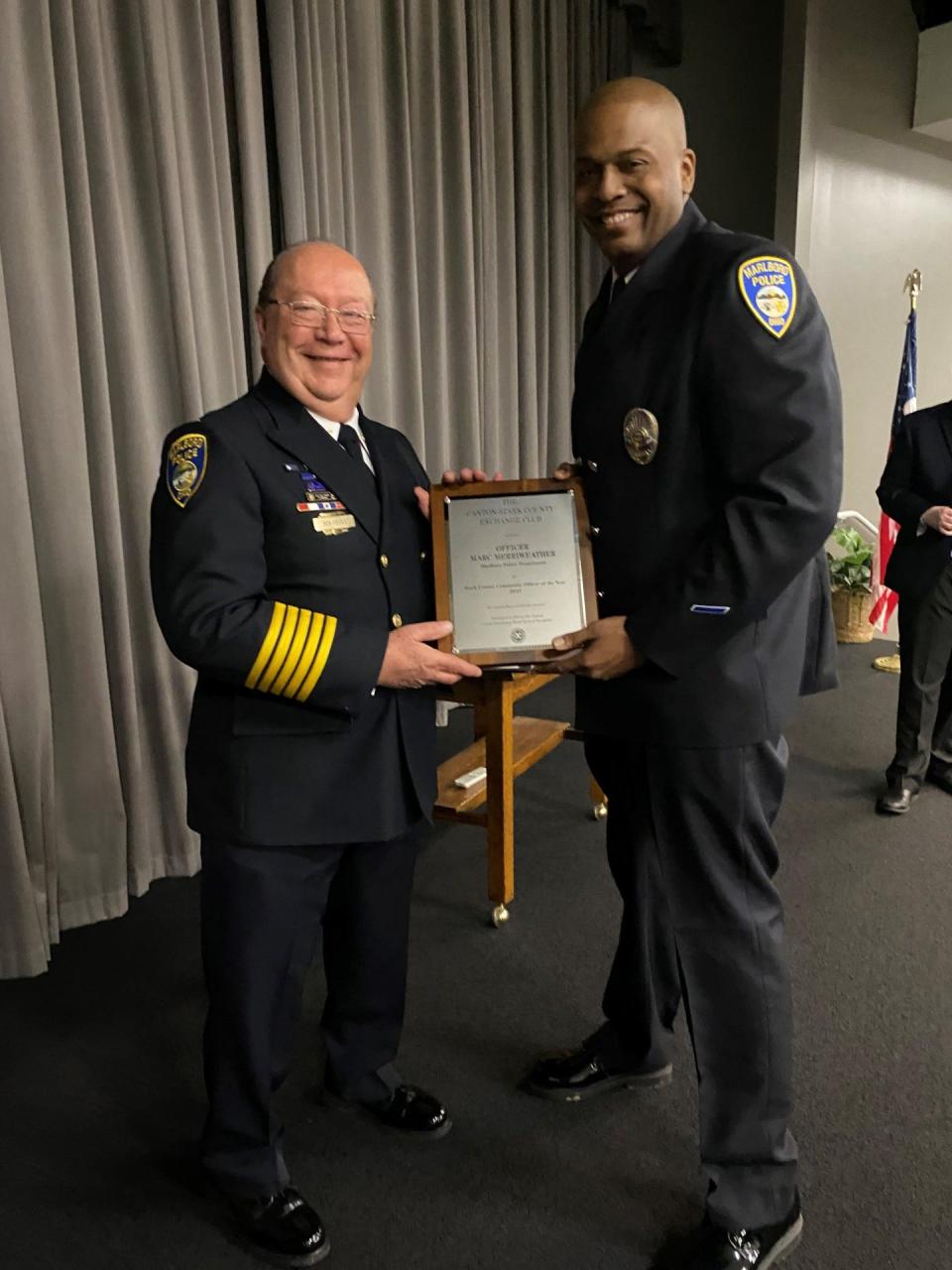 Marlboro Township Police Chief Ron Devies, left, stands with Marc Merriweather, who was named Community Police Officer of the Year on Wednesday at the Crime Prevention Breakfast sponsored by the Exchange Club of Canton-Stark County.