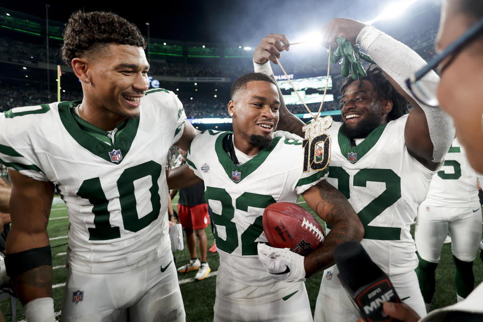 New York Jets wide receiver Xavier Gipson (82) celebrates with teammates after returning a kickoff for a touchdown against the Buffalo Bills in overtime of an NFL football game, Monday, Sept. 11, 2023, in East Rutherford, N.J. (AP Photo/Adam Hunger)