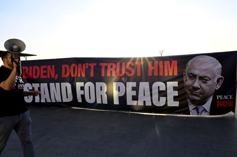 People hold a banner at a protest demanding the end of the Israel-Hamas War outside the Tel Aviv branch of the U.S. Embassy earlier this month. There have been ongoing calls for Netanyahu to step down. Photo by Debbie Hill/ UPI