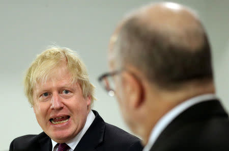 Britain's Foreign Secretary Boris Johnson speaks next to Argentina's Foreign Minister Jorge Faurie during a news conference in Buenos Aires, Argentina, May 22, 2018. REUTERS/Marcos Brindicci