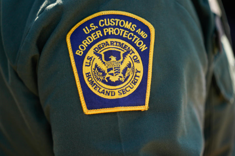 An agents wears a U.S. Customs and Border Protection badge during a tour of a facility in El Paso, Texas, on Friday, June 28, 2021. / Credit: Yuri Gripas/Abaca/Bloomberg via Getty Images