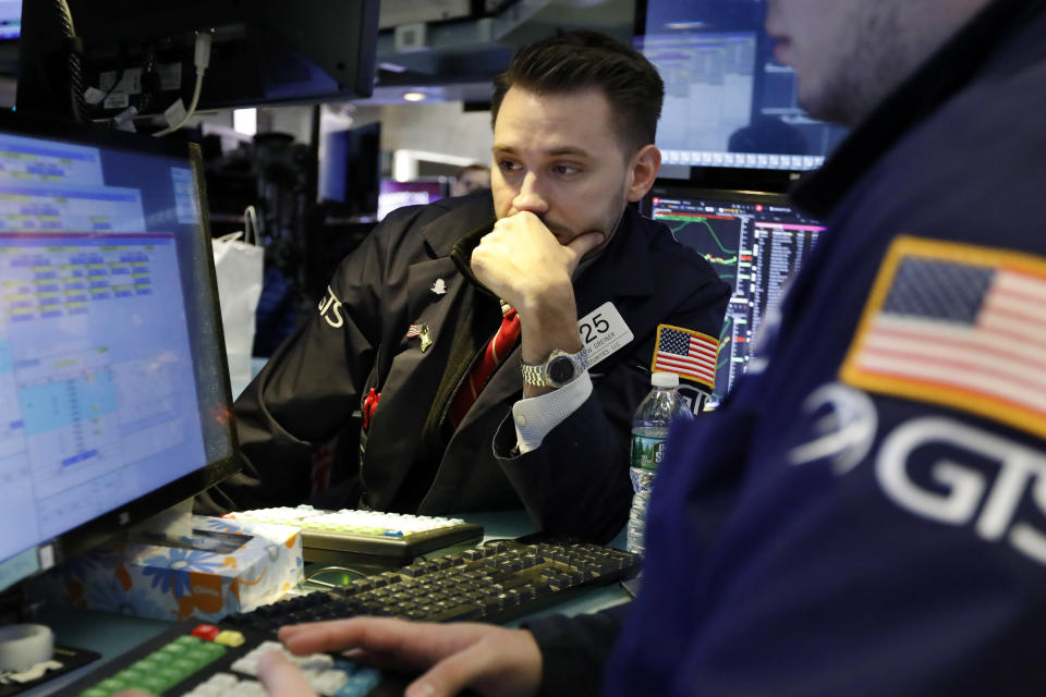 Specialist Matthew Grenier works on the floor of the New York Stock Exchange, Tuesday, March 5, 2019. Stocks are opening slightly lower on Wall Street led by losses in banks and technology companies. (AP Photo/Richard Drew)