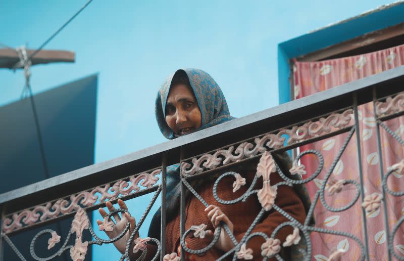 Nafisa, mother of Mohammed Mohsin, who died during clashes with police following protests against a new citizenship law, mourns as she stands in the balcony of their house in Meerut