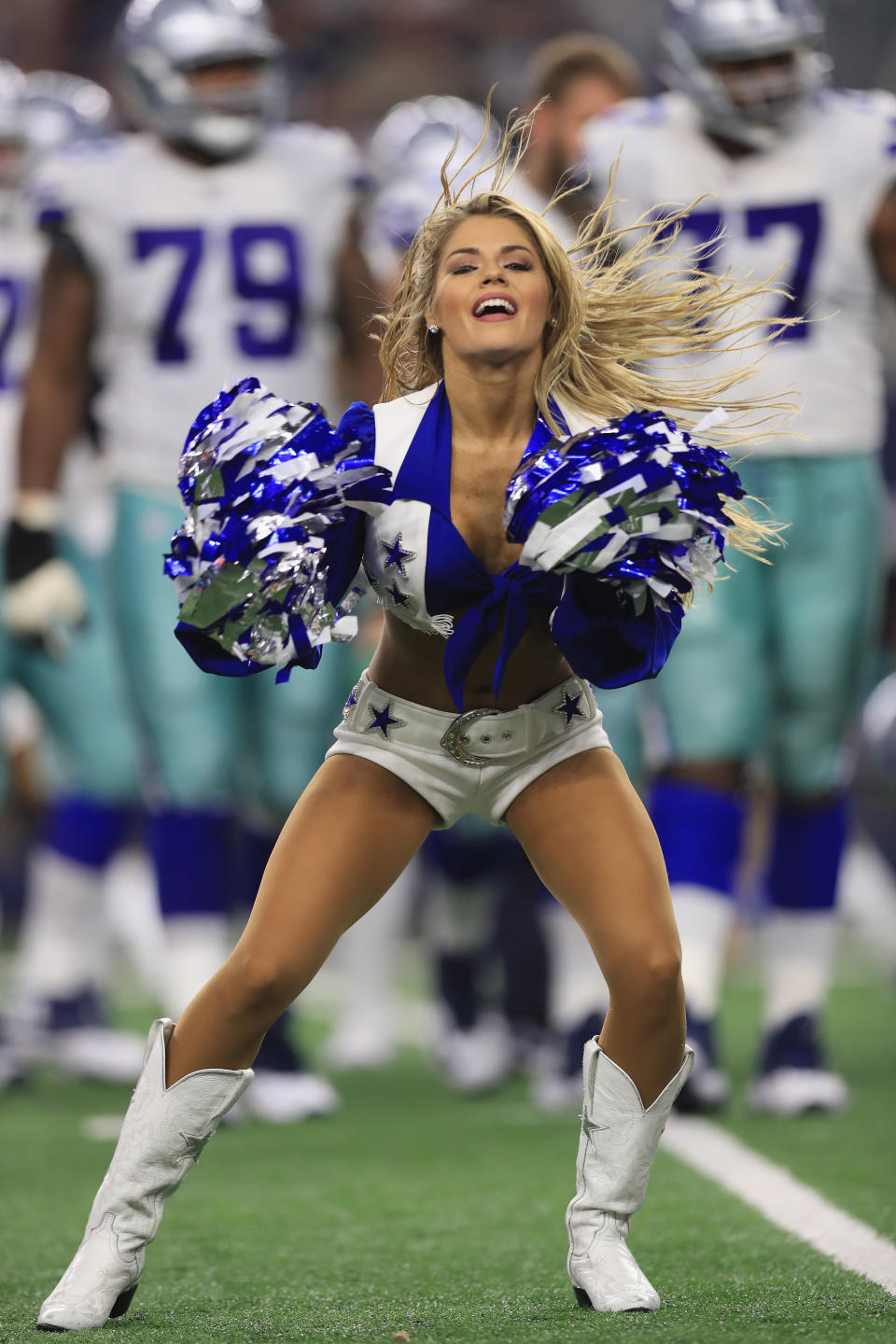 <p>A Dallas Cowboys cheerleader performs at AT&T Stadium on September 10, 2017 in Arlington, Texas. (Photo by Ronald Martinez/Getty Images) </p>