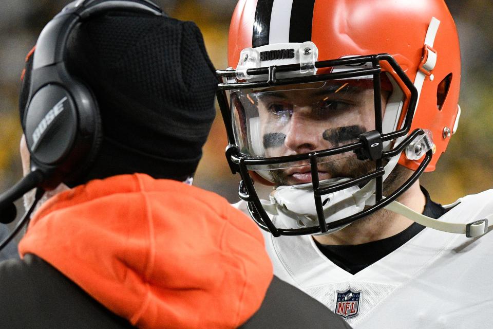 Cleveland Browns quarterback Baker Mayfield (6), right, talks with head coach Kevin Stefanski on the sideline in the first half of an NFL football game against the Pittsburgh Steelers, Monday, Jan. 3, 2022, in Pittsburgh. (AP Photo/Don Wright)