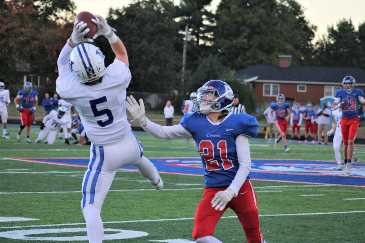 Highlands junior Carson Class leaps to make a tough catch on the sideline for a big gain as Highlands defeated Conner 55-0 in KHSAA high school football Sept. 30, 2022, at Conner High School, Hebron, Ky.