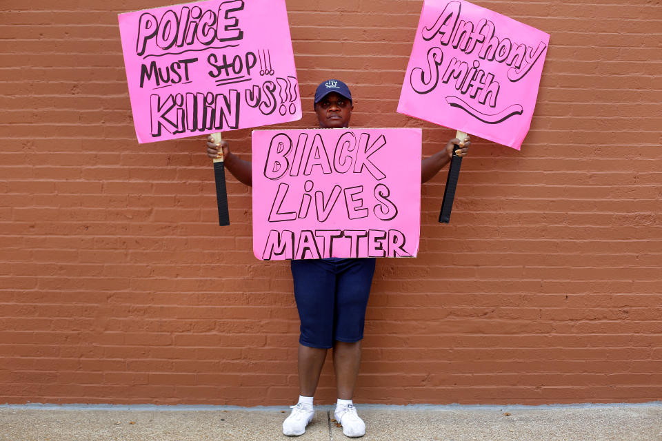 <p>A woman poses for a portrait as she protests the not guilty verdict in the murder trial of Jason Stockley, a former St. Louis police officer charged with the 2011 shooting of Anthony Lamar Smith, in St. Louis, Mo., Sept. 17, 2017. (Photo: Joshua Lott/Reuters) </p>